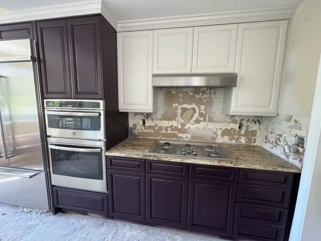 Two Tone Kitchen Cabinet Painting in Simi Valley California Kitchen with newly painted dark purple lower and white upper cabinets in Simi Valley California.