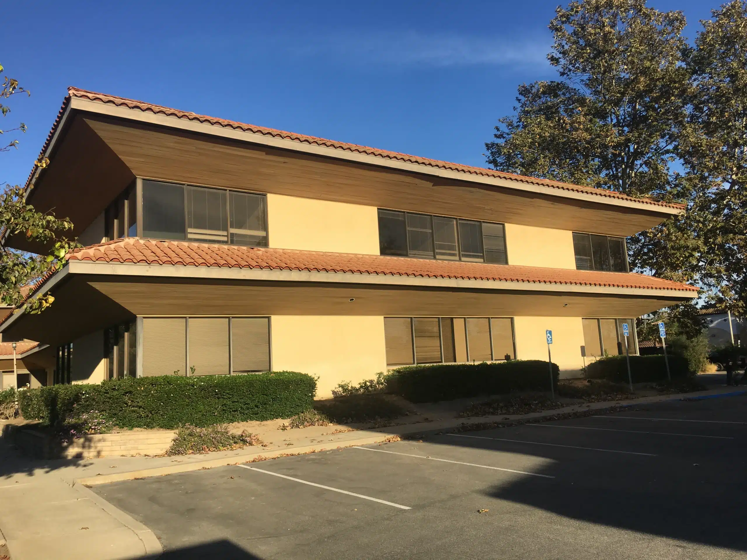 Business Exterior Painting Simi Valley California Commercial office building with tan exterior walls and a red tile roof in Simi Valley California.